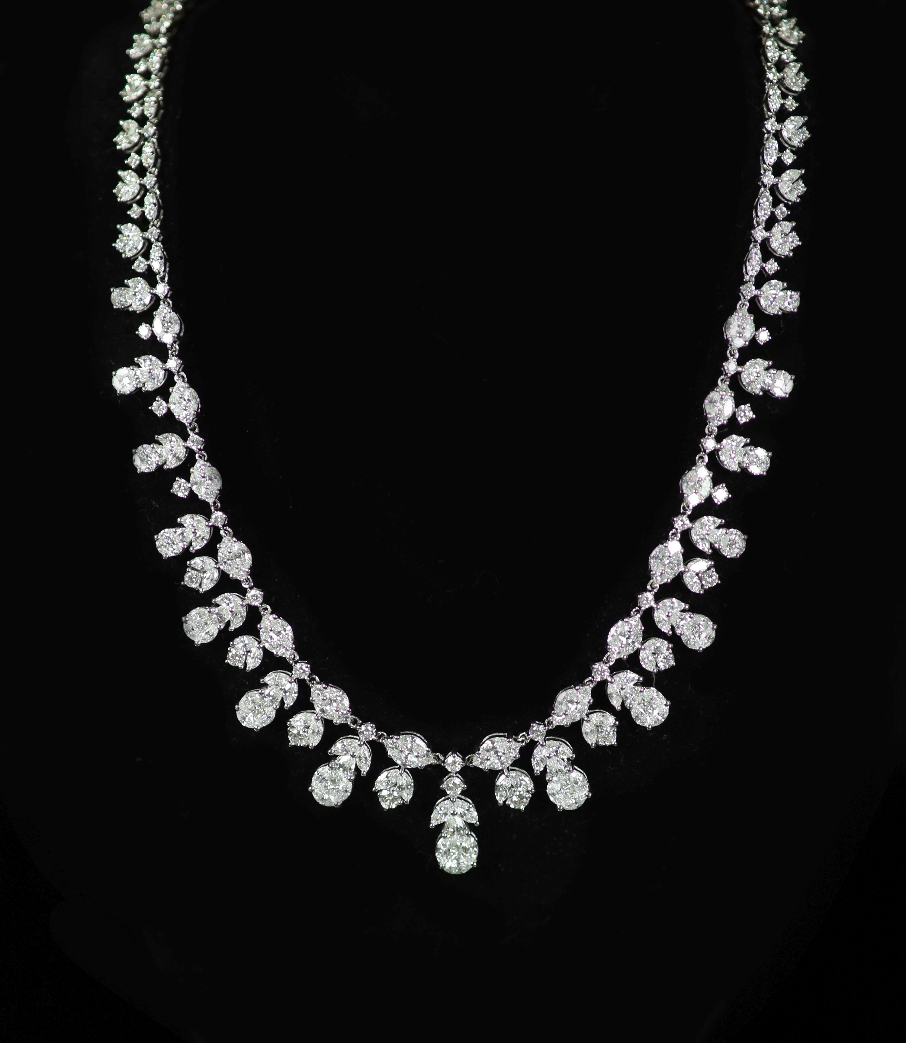 A modern continental 18k white gold and diamond cluster set drop fringe necklace